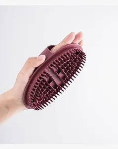 Silicone body massage brush detail view, ergonomic handle grip for relaxing and slimming.