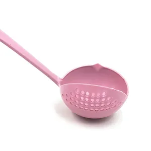 Pink plastic soup colander detail shot, kitchen slotted spoon close up, drain spoon feature