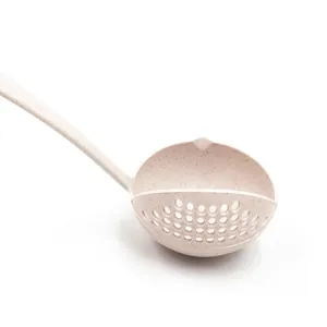 Detailed view of the wheat straw two-in-one soup colander spoon, showing strainer holes.