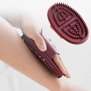 Silicone body massage brush for cellulite reduction and meridian relaxation, ergonomic hand strap.