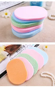Multi-color oval facial cleansing sponges, soft cellulose makeup puffs for deep daily facial care.