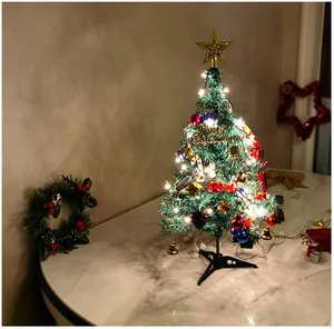 Pre-lit 50cm mini artificial Christmas tree with gold star and ornaments on table
