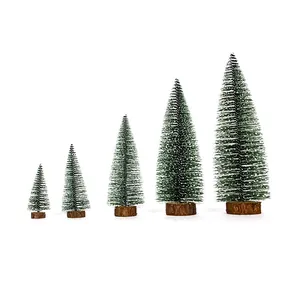 Set of five miniature frosted Christmas trees in varying sizes with wooden bases.