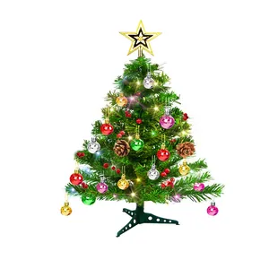 Mini tabletop Christmas tree decorated with colorful balls, pinecones, and lights