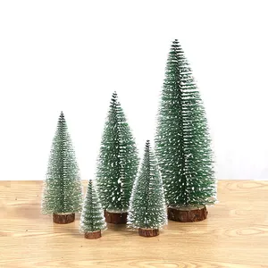 Set of five mini frosted green cedar Christmas trees with natural wooden bases for decor