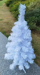 Detailed outdoor macro view of a 60cm pure white desktop Christmas tree decoration