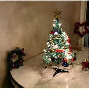50cm artificial Christmas tree with festive ornaments and LED lights on marble table