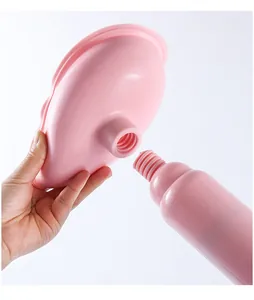 Pink mini toilet plunger drain unblocker detail shot showing threaded connection structure.