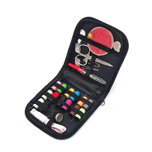 Portable travel sewing kit set with colorful thread spools, scissors, and needles for home use.