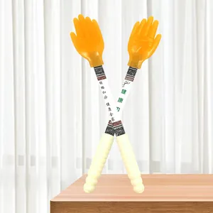 Silicone meridian massage pat stick detail view, showing ergonomic handle and hand-shaped head.
