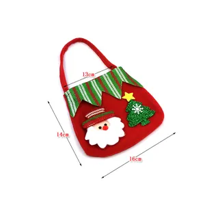 Detailed view showing dimensions 16cm by 14cm for this red Christmas Santa gift bag