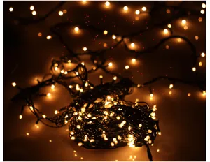 Close-up of glowing warm Christmas string lights featuring a beautiful bokeh background