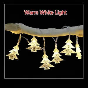 Warm white LED Christmas tree string lights hanging on a natural wood branch for festive decor