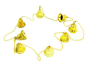 Detailed view of a festive golden Christmas bell garland string with embossed patterns