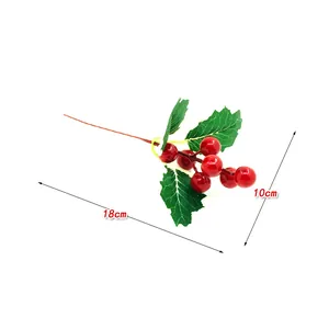 Artificial red Christmas berries with green leaves, size 18cm by 10cm, close-up view.
