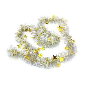 Close-up of sparkling silver and gold star tinsel garland for Christmas decoration