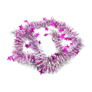 Close-up of silver and magenta Christmas tinsel garland with star sequins decoration