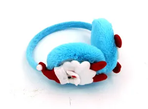 Close-up of blue plush winter warm earmuffs with cute Santa Claus character decoration