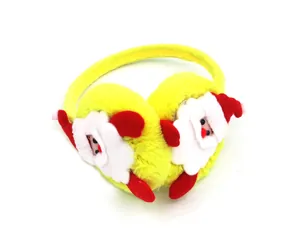 Detailed close-up of yellow plush Christmas earmuffs featuring festive Santa Claus figures