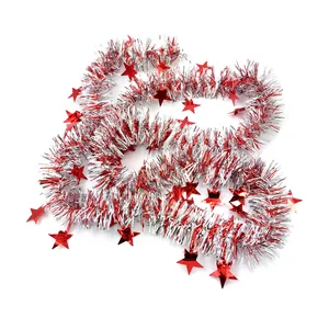 Detailed macro view of red and silver Christmas tinsel garland with star charms