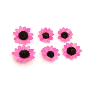 Detailed macro view of six vibrant pink wooden sunflower heads for DIY craft accessories.