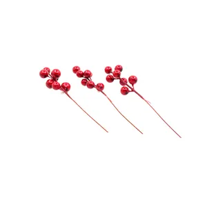 Set of three artificial red Christmas berry stems for festive DIY holiday tree decorations