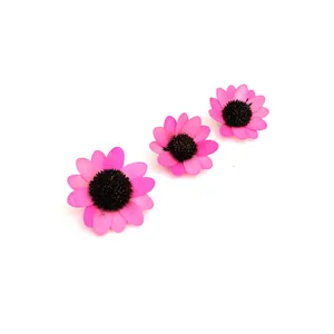 Detailed view of pink wooden sunflower petals for DIY crafts and holiday decor.
