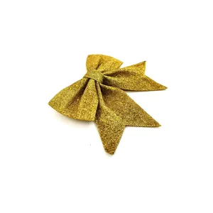 Nahaufnahme goldene Glitzerschleife für Weihnachtsbaum und DIY-Geschenkverpackung