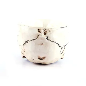 Detailed view of a skull-shaped flower pot for Halloween home decoration.
