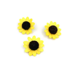 Macro view of three yellow decorative wooden sunflowers for DIY handicraft and decor