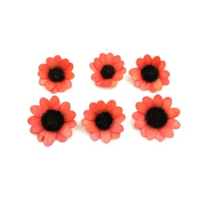 Macro view of six small handmade wooden sunflowers for DIY Christmas craft decoration