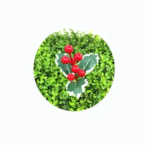 Artificial red Christmas berries with green holly leaves for DIY holiday crafts