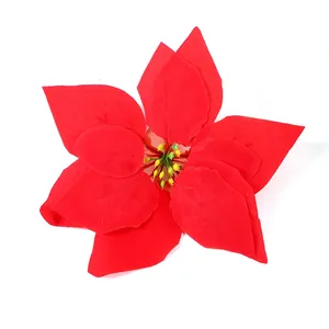Detailed top view of a red artificial poinsettia flower with vibrant petals for Christmas