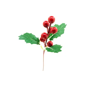 Detailed view of artificial Christmas red berries with green holly leaves for DIY.