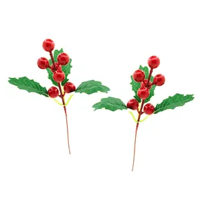 Artificial red Christmas holly berries with green leaves detail for DIY crafts