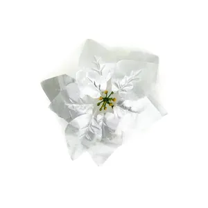 Detailed macro view of a shiny silver artificial poinsettia for Christmas decoration