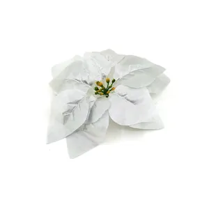 Macro detail of a white silk artificial poinsettia flower used for Christmas tree decor