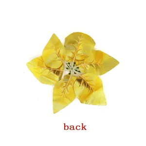 Detailed back view of golden artificial poinsettia flower for Christmas tree decor