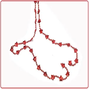 Close-up detail view of a glossy red star bead garland used for Christmas tree decoration