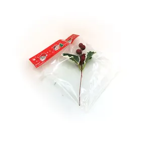 Artificial red berries with holly leaves packaged for Christmas tree DIY decor