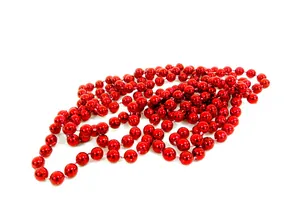 Detailed view of a glossy red metallic bead garland for Christmas tree decoration