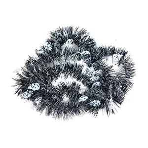 Close-up detail of black Halloween tinsel garland featuring white skull decorations for parties