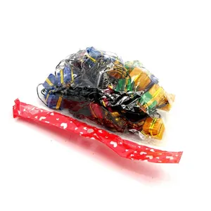 Packaging detail of colorful Christmas gift box LED string lights in a clear plastic bag.