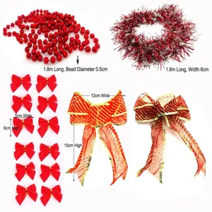 Detail of Christmas tree decoration set including red garland, tinsel and bows.