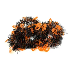 Close-up detail of black and orange Halloween tinsel garland with pumpkin ghost cutouts