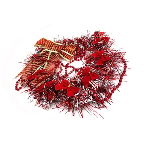 Detailed view of red and silver Christmas tinsel wreath with bows and beads