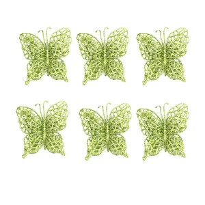 Six green glittery butterfly Christmas tree ornaments with fine hollow design.