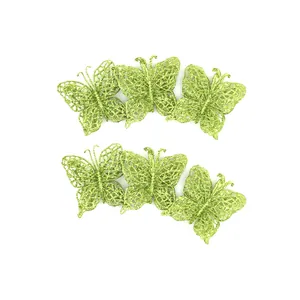 Detailed view of six sparkling green glitter butterfly ornaments for Christmas tree