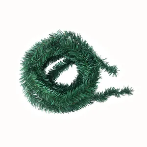 Close-up of 5.5m green artificial Christmas garland with realistic PVC needles