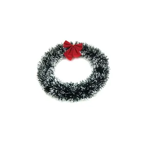 Close-up detail of a 30cm Christmas tinsel wreath featuring a festive red bow on top